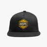 Black flat-bill snapback cap with gold HOPE hexagon embroidery on left panel