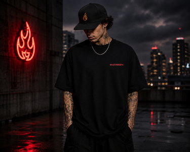 Model wearing Rebel Mythic Oversized Tee in urban night setting