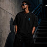 Zane Mode Tee showing oversized fit, 240 GSM heavyweight cotton, 100 percent cotton construction, Pantone Black C color